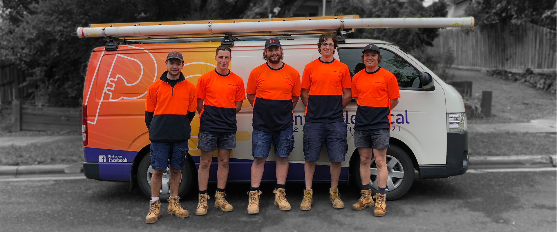 The Phantom Electrical team standing with their service vehicles, Melbourne eastern suburbs